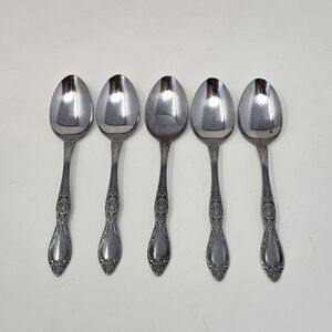 Elegant Silver Spoon Set with Decorative Handles
